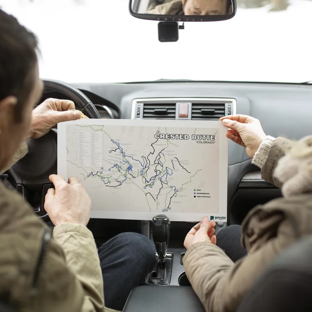 Crested Butte_senior-people-road-trip-with-map